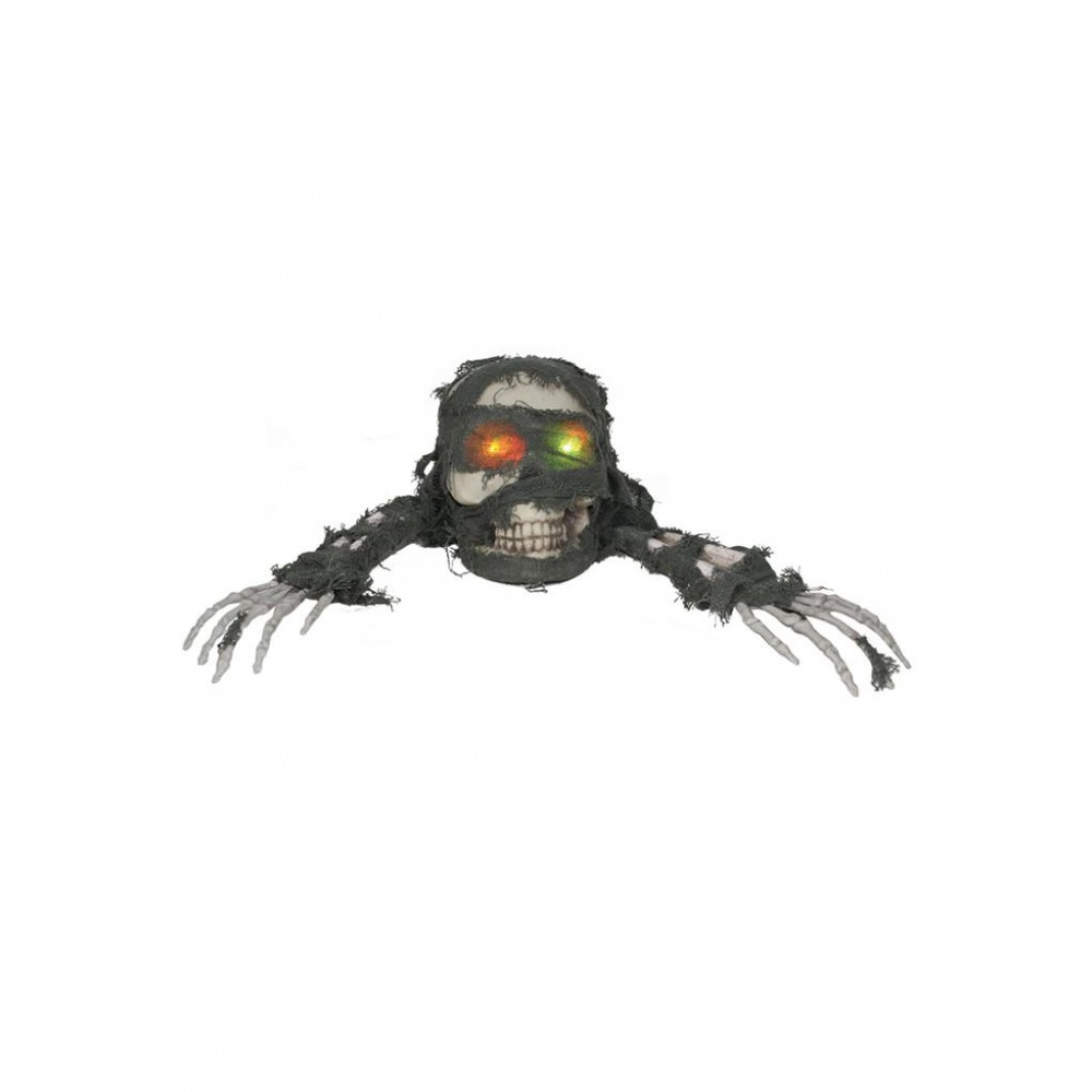 Halloween lebka s rukami a svietiacimi očami Halloween lebka s rukami a svietiacimi očami